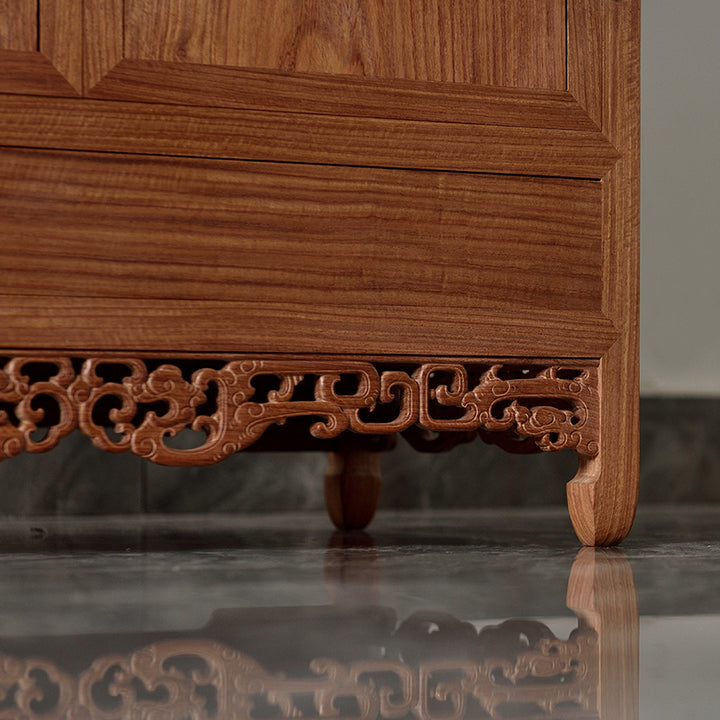 Luxurious Pterocarpus macrocarpus cabinet with detailed dragon carvings.