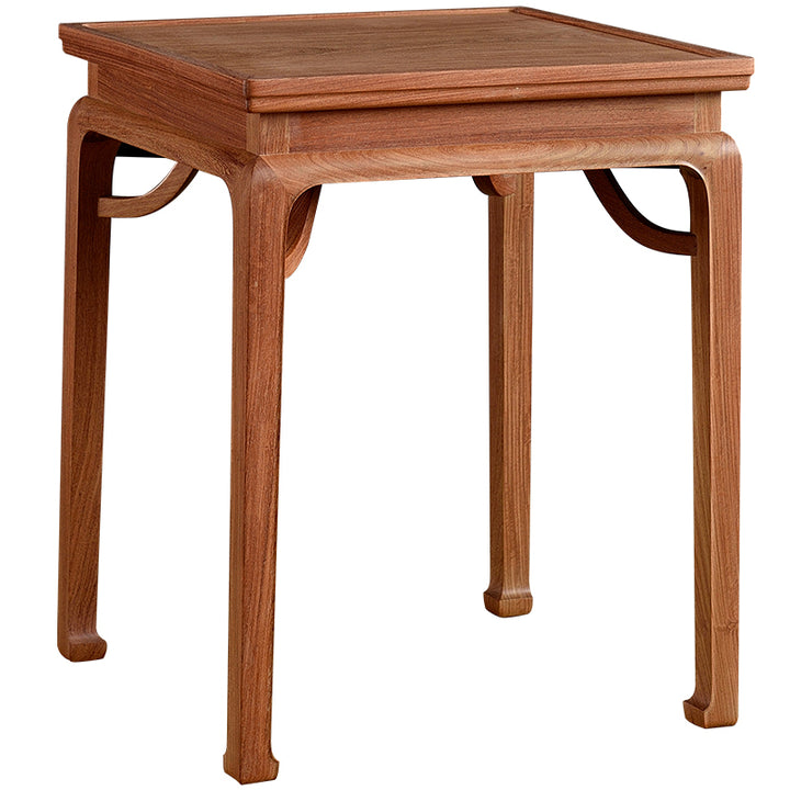 Handcrafted Pterocarpus macrocarpus side table with intricate details.