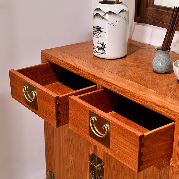 Pterocarpus macrocarpus sideboard featuring four drawers and decorative brass fittings.